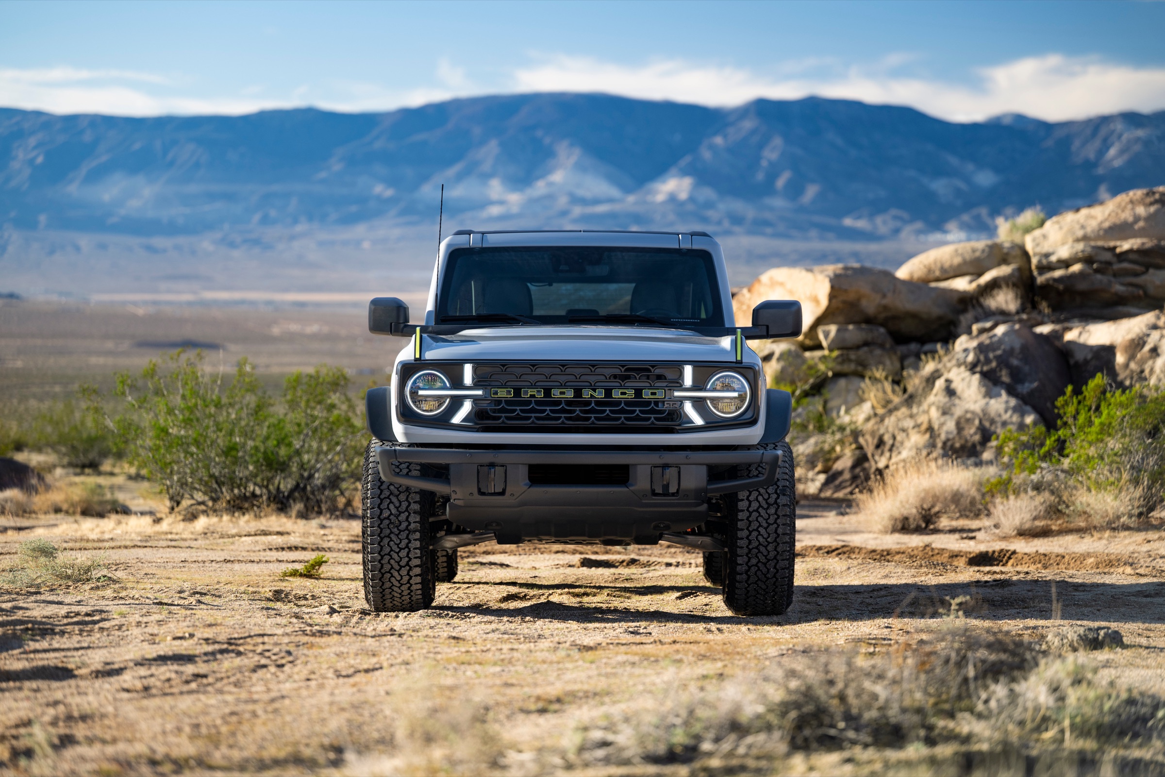 Front view of a 2027 Ford Bronco RTR moving through desert terrain