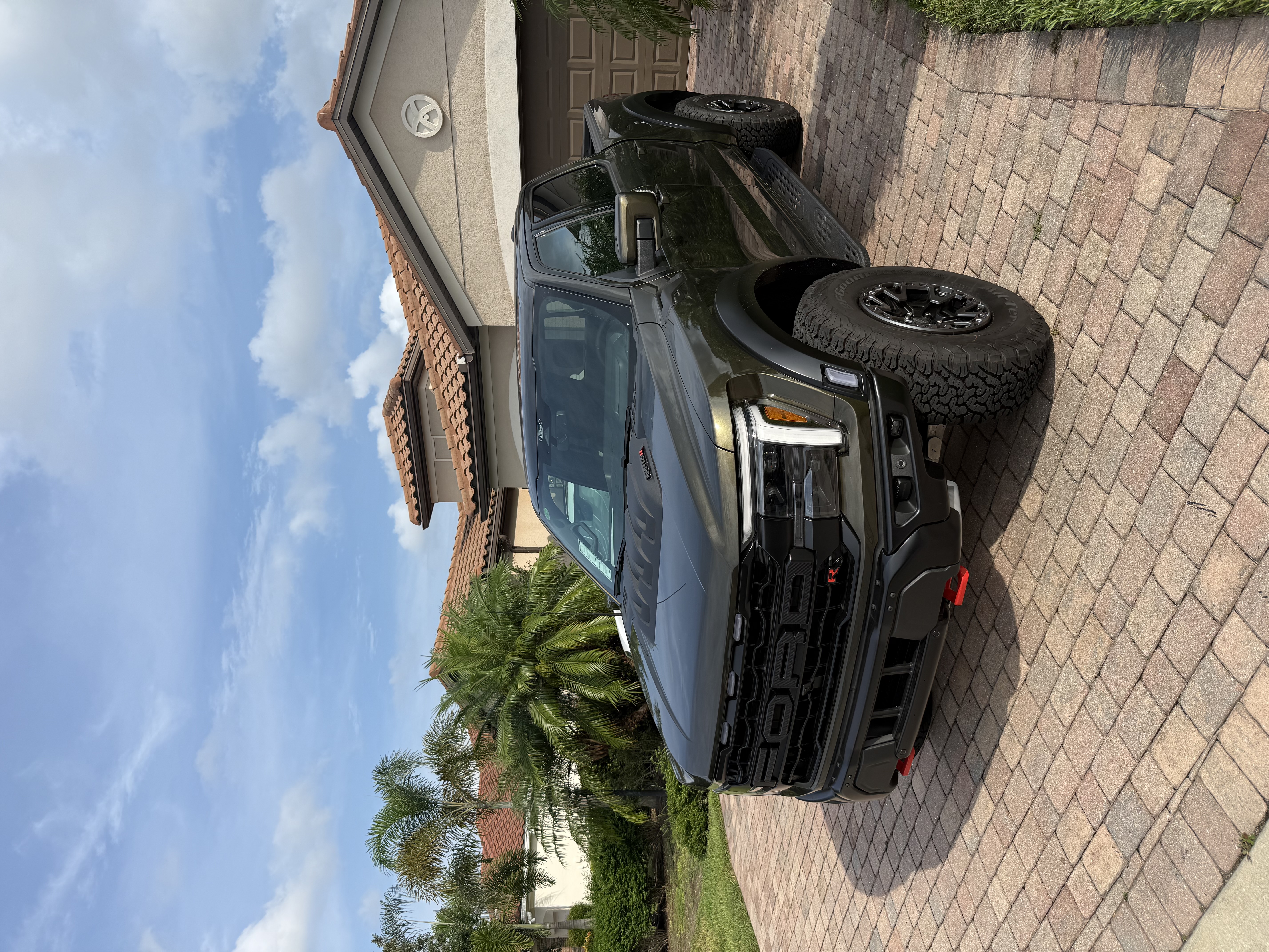 2026 Ford F 150 Raptor R parked on a driveway under a Florida sky