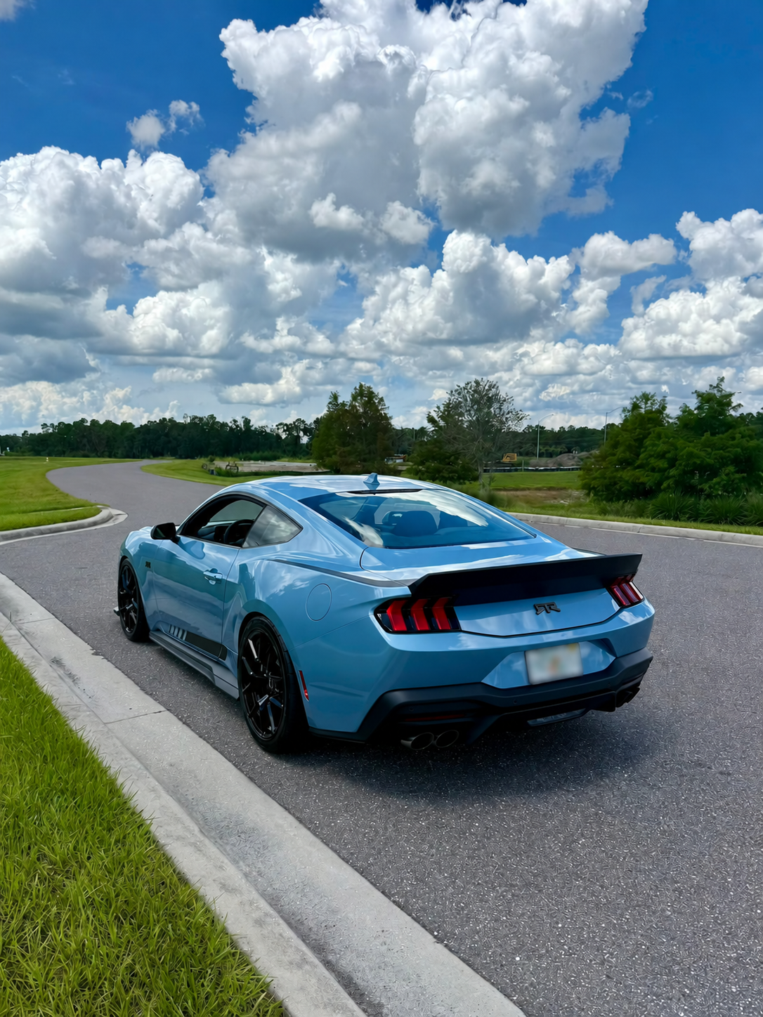 the road behind view of the Brittany Blue Mustang RTR Spec 3