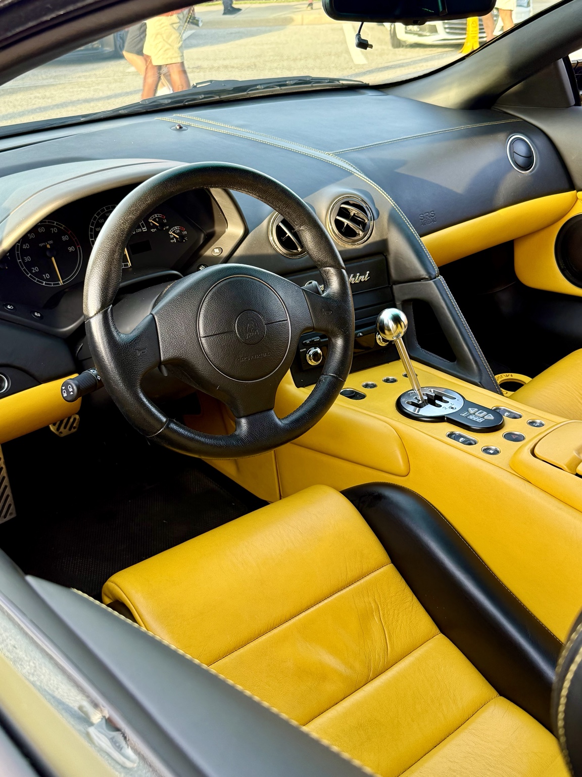 Yellow and black Lamborghini Murciélago interior with gated manual shifter
